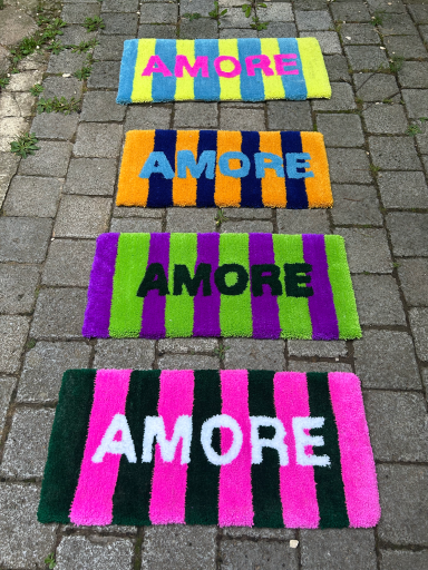 four rugs with amore letters and stripes
