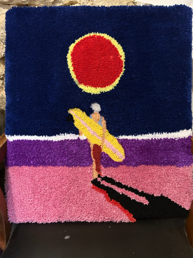 colorful rug with surfer in the sun down