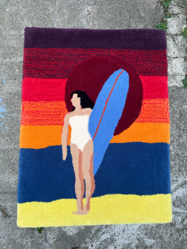 Surfer girl in front of sundown as a rug