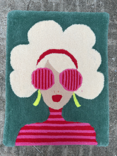 white haired girl with red sunglasses on a rug